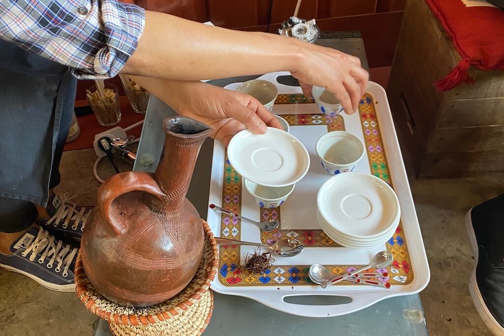 Your local tour guide Sefanit preparing the cups for the coffee ceremony for her guests.