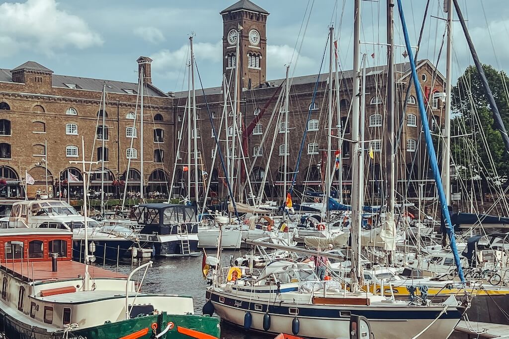 At a harbor on the Thames, that you'll get to visit on this Iberian Footprints Tour of London, with many yachts and small boats at dock.