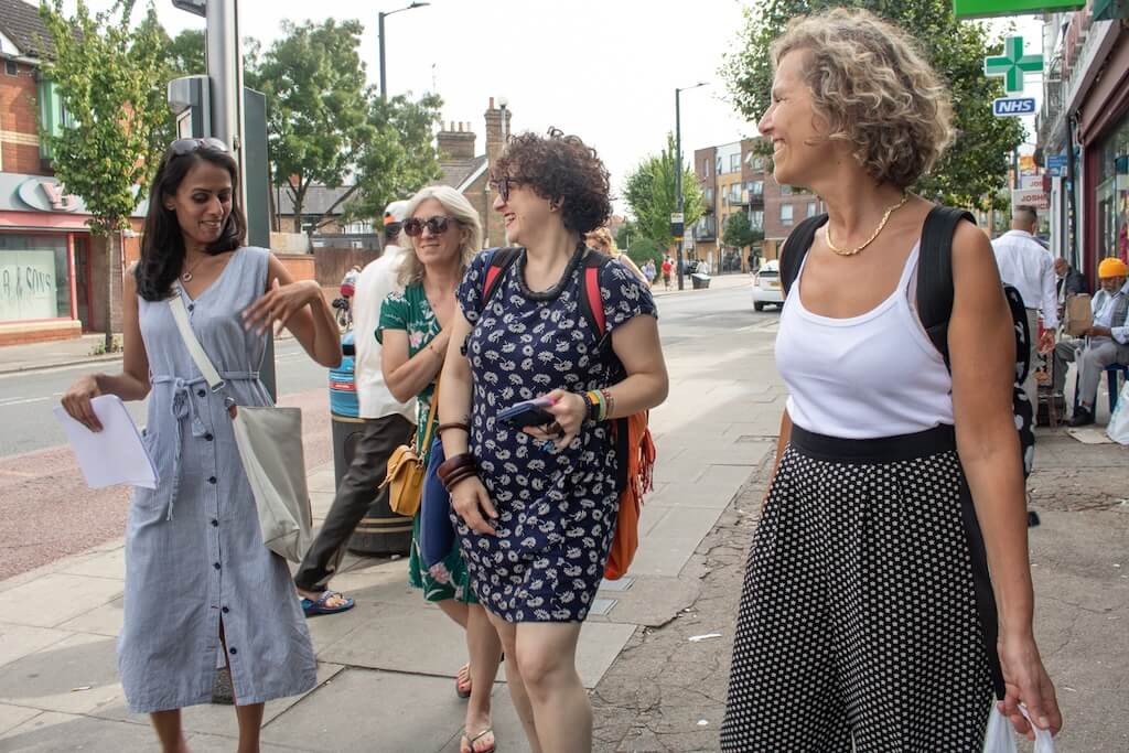 Local tour guide, Vaishali, leading her group of guests on the Indian Tour through the streets of the Indian neighbourhood in London.