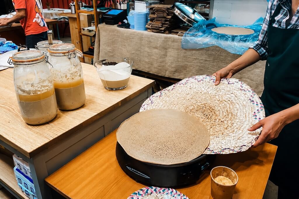Fresh injera being prepared during the Ethiopian food tour in London.