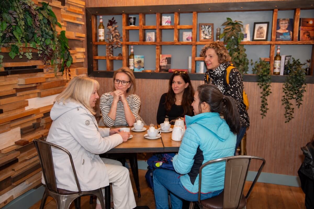 Small group enjoying tea and scones during the Edinburgh hidden histories tour