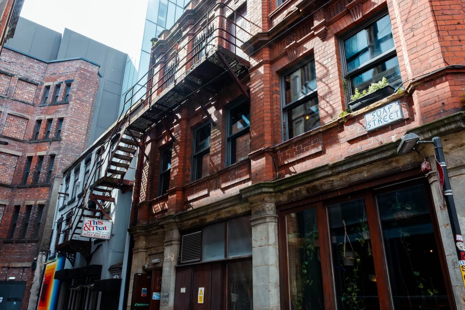 Exterior of This & That Café on Soap Street in Manchester.