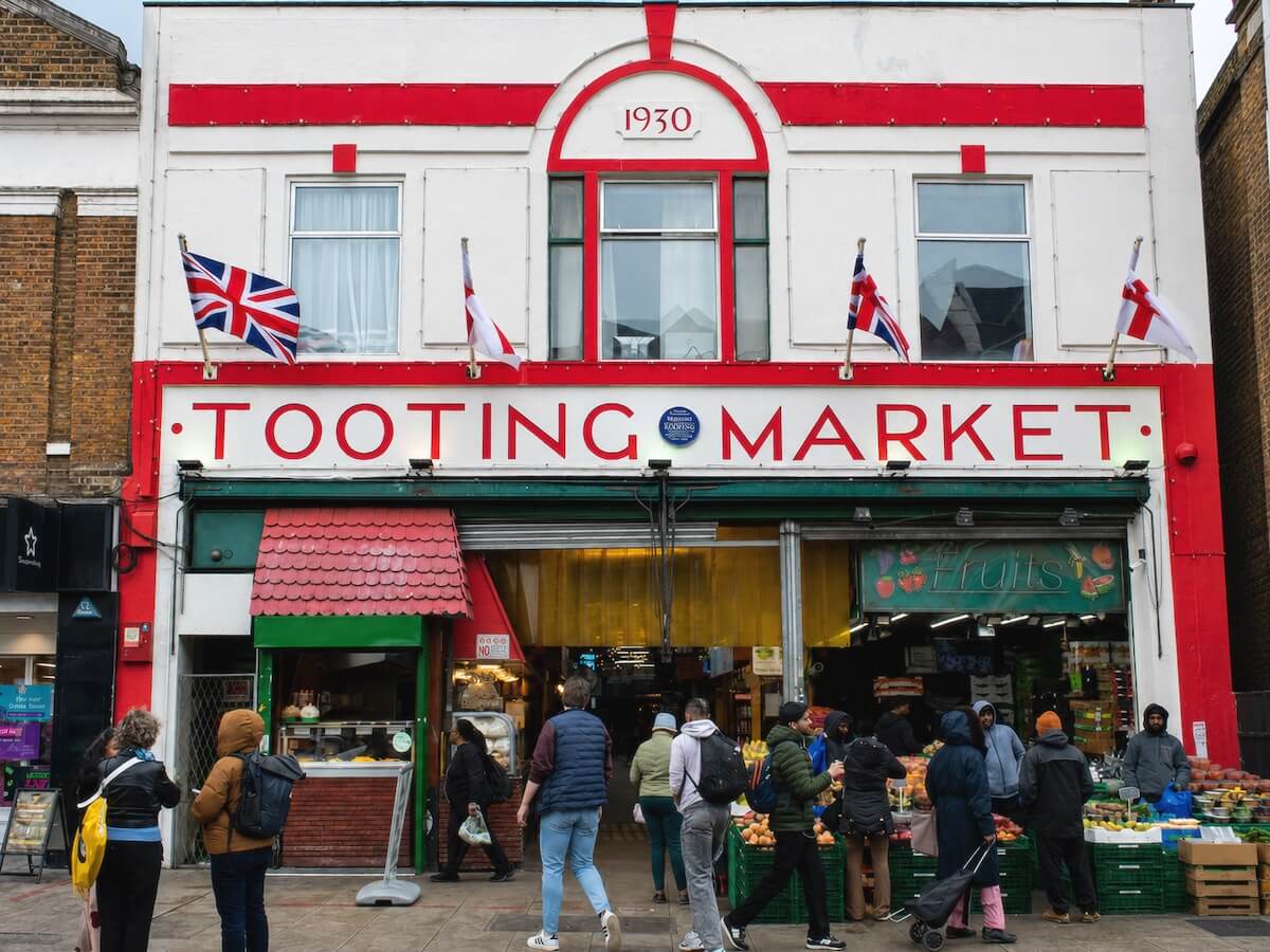 Visitors outside Tooting Market in London.