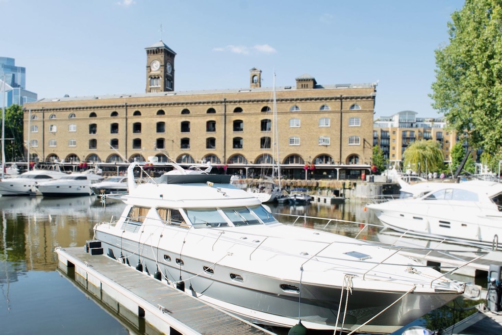 Yachts parked at the docks on the river Thames in front of the former Portuguese port.